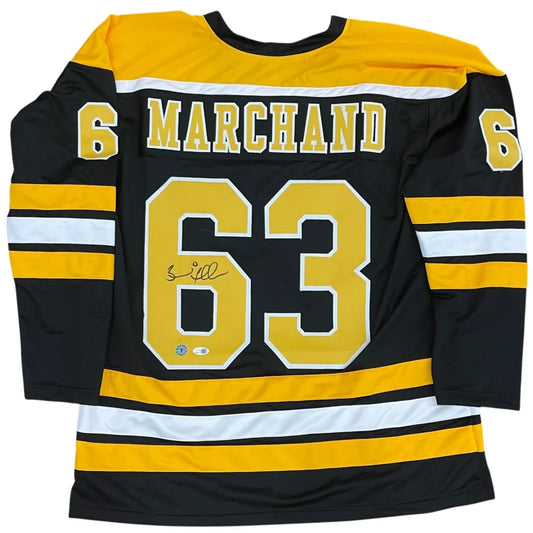 Brad Marchand autographed black custom jersey with gold accents and number 63