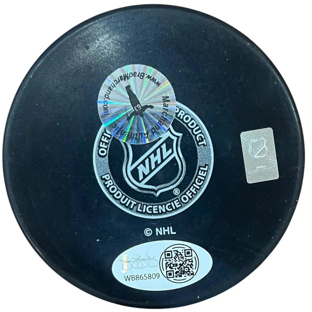 Brad Marchand autographed Boston Bruins hockey puck with black NHL official design