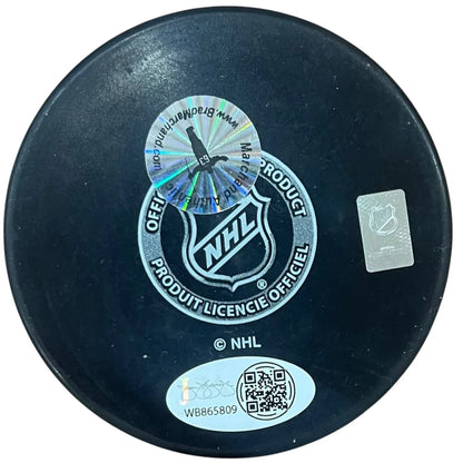 Brad Marchand autographed Boston Bruins hockey puck with black NHL official design