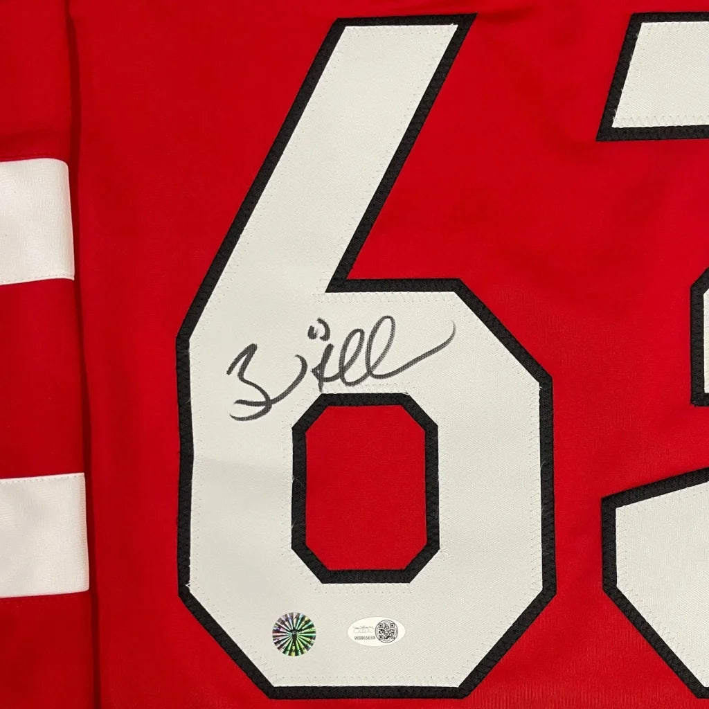 Brad Marchand signed Team Canada custom jersey with red base, white stripes, and number 67