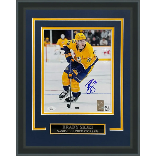Framed 8x10 photo of autographed Brady Skjei Nashville Predators gold jersey