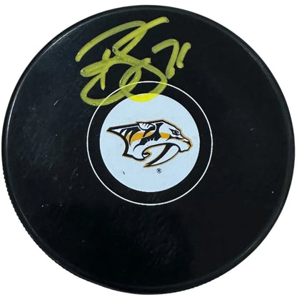 Signed Brady Skjei Nashville Predators hockey puck with holo sticker