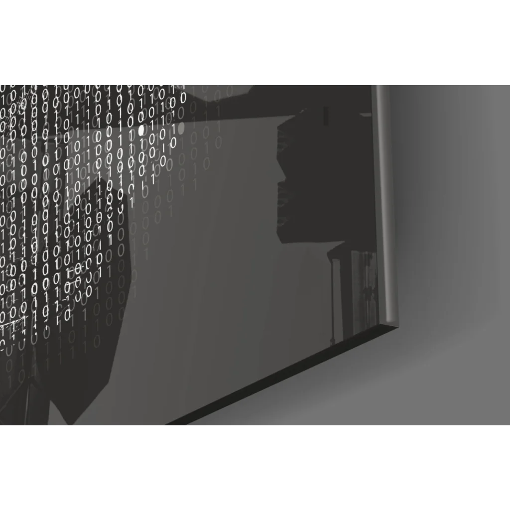 Sleek dark gray laptop with binary code on minimalist glass wall art