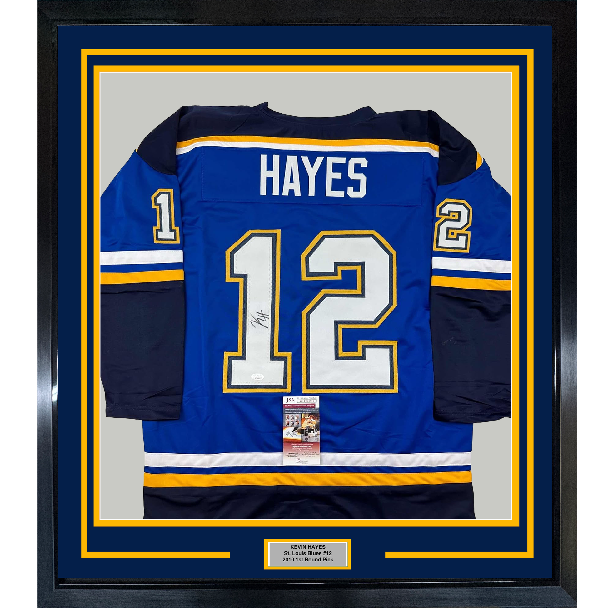 Framed St. Louis Blues #12 Hayes jersey in blue with yellow and white trim, displaying autographed number and nameplate against dark matting.