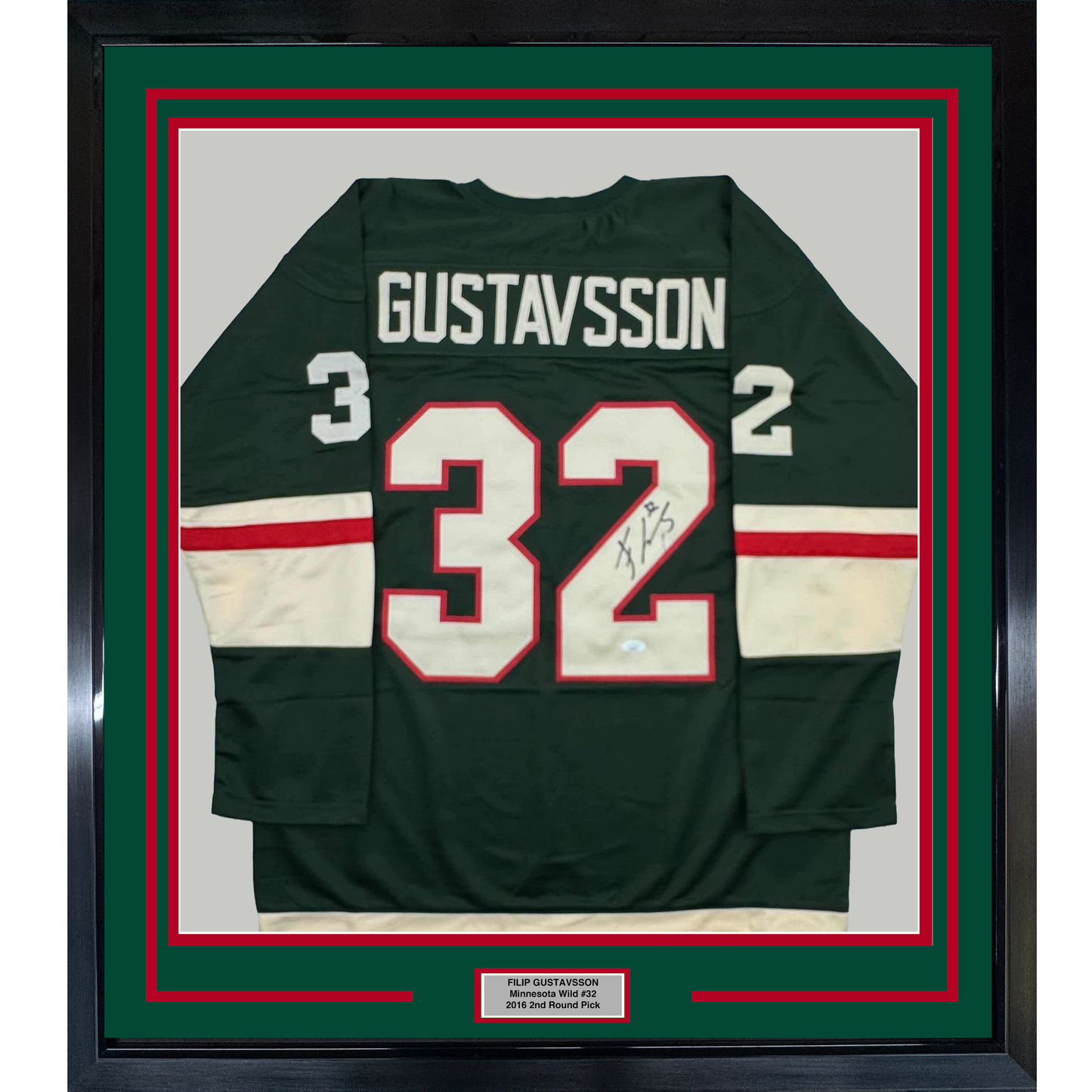Framed dark green hockey jersey displaying number 32 with "GUSTAVSSON" nameplate and signature, bordered by red and white stripes, mounted in green and red matting with black frame.