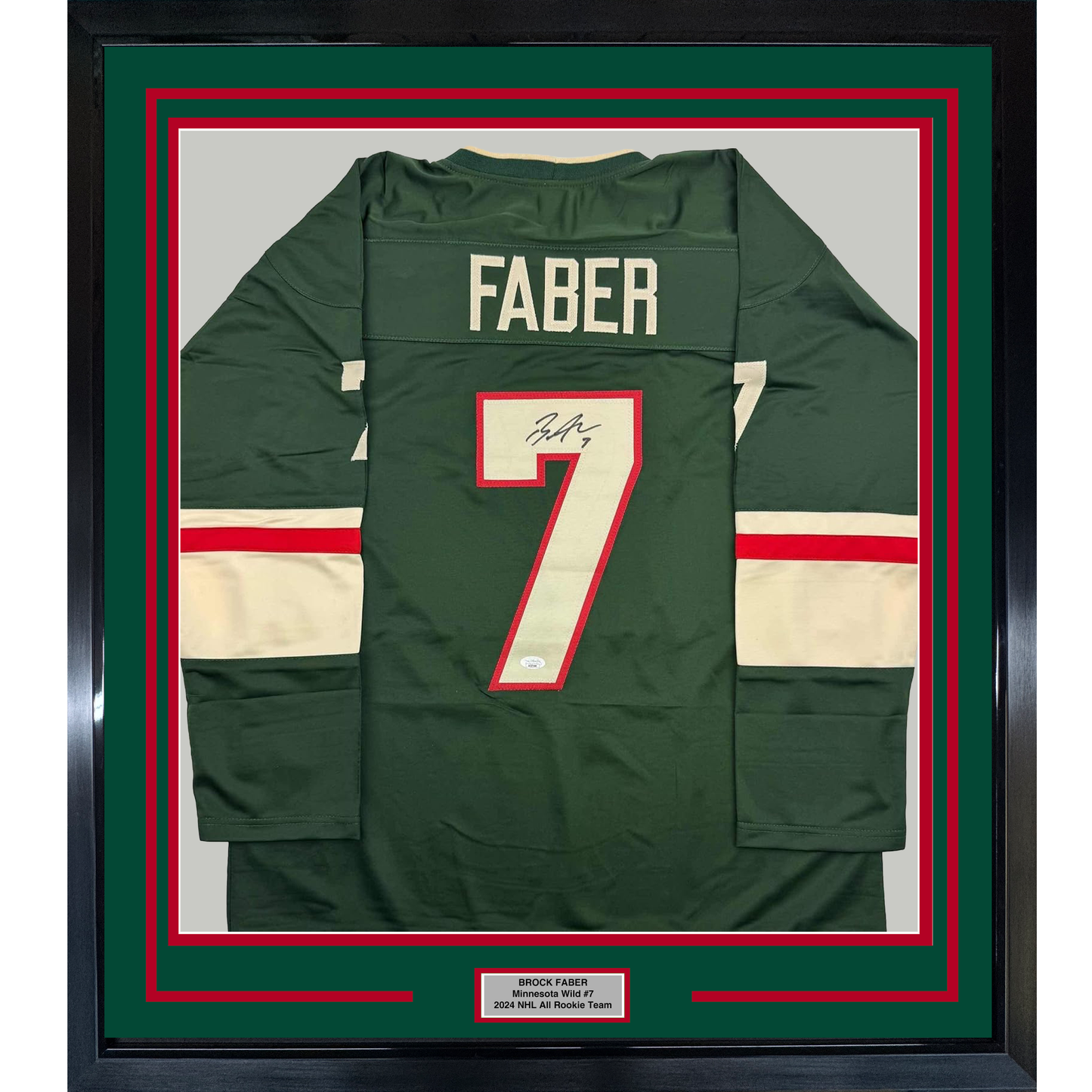 Framed dark green hockey jersey with "FABER" and number 7 displayed flat, featuring red and cream horizontal stripes and an autographed nameplate below.