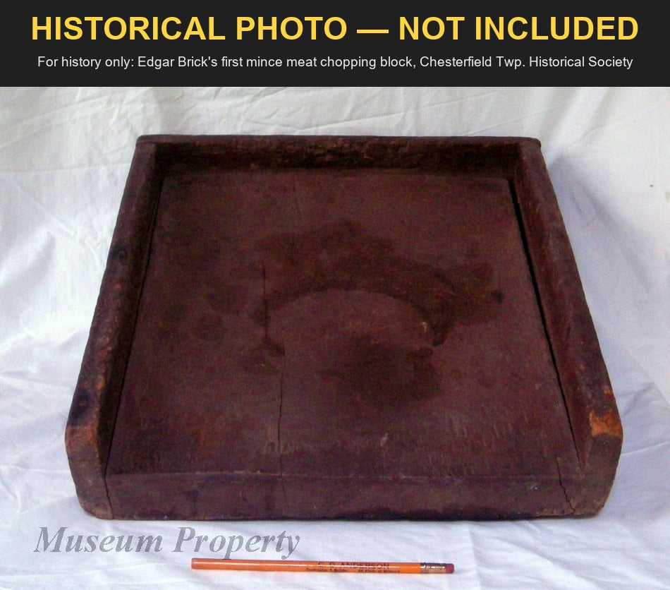 Edgar Brick's first mince meat chopping block, dark wood with raised sides, a pencil beside it for scale; Chesterfield Township Historical Society photo, for history only, not included.