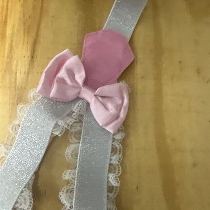 Pink satin bow on silver glitter garter suspender with lace for bachelorette party