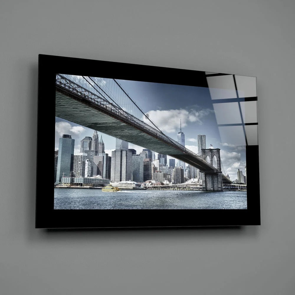 Black-framed Brooklyn Bridge glass wall art over Manhattan skyline