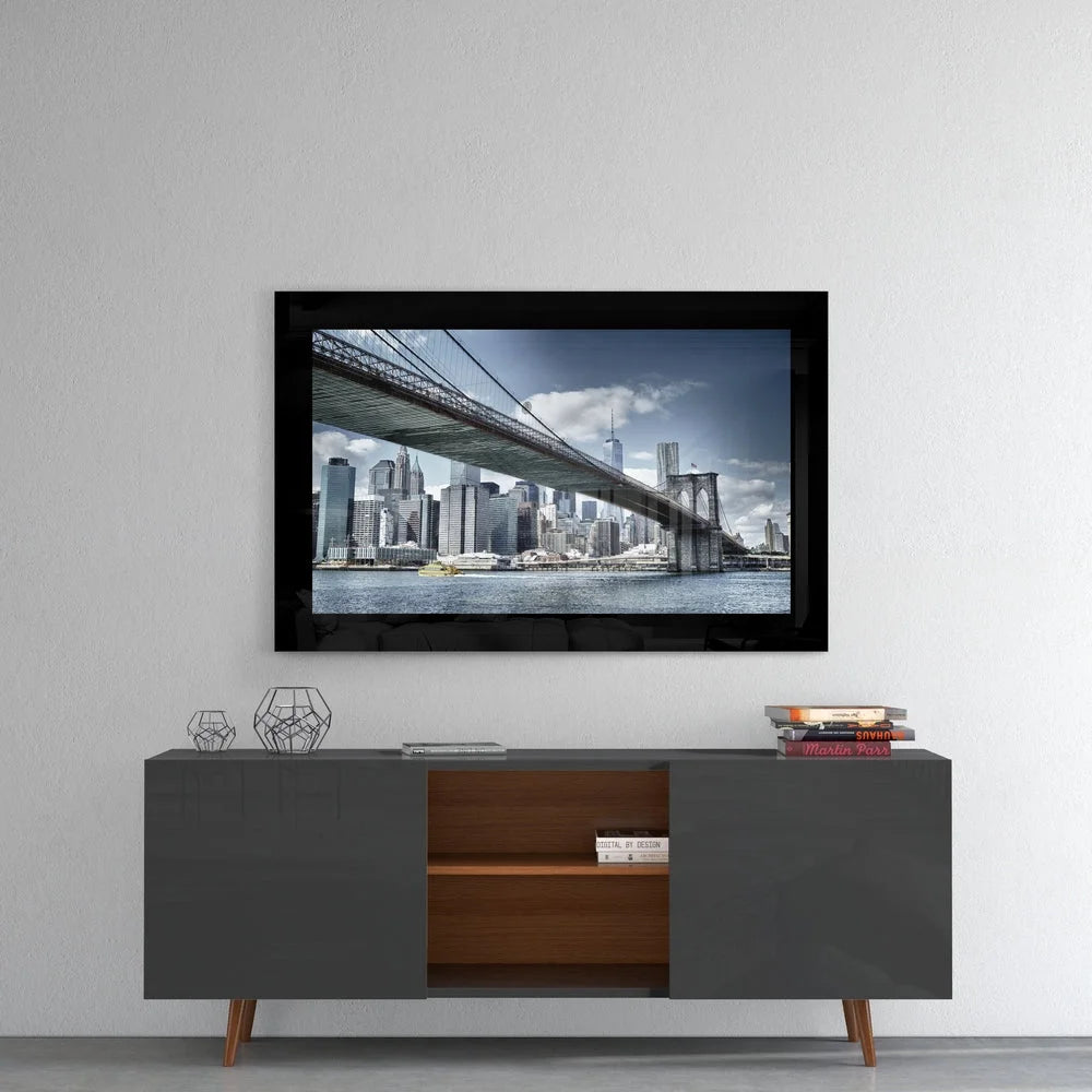Black-framed Brooklyn Bridge glass wall art over city skyline