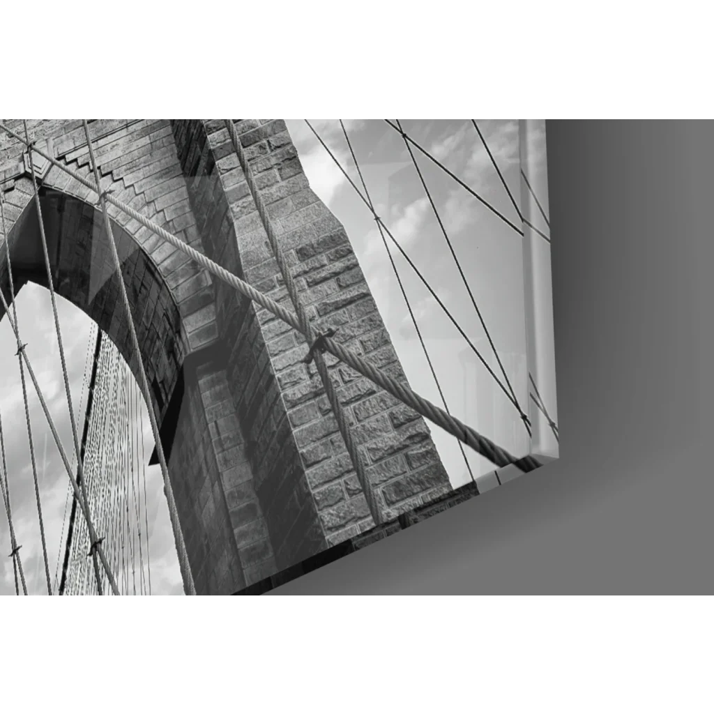 Stone archway suspension bridge with twisted cables in glass wall art