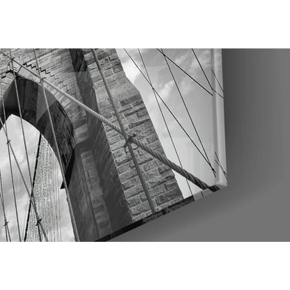 Stone archway suspension bridge with twisted cables in glass wall art