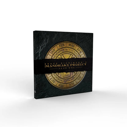 Dark-colored Bruce Dickinson Mandrake Project Deluxe Edition book set with gold calendar design