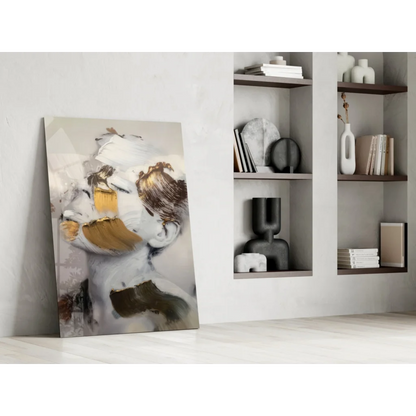 Stunning gold abstract face glass wall art canvas with bold white, gold, and brown strokes on gray