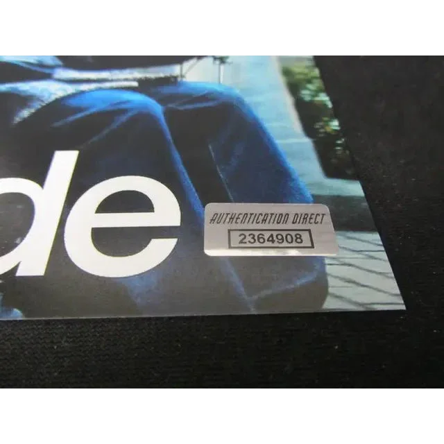 Holographic authentication sticker with serial number on Bryan Cranston signed 8x10 photo