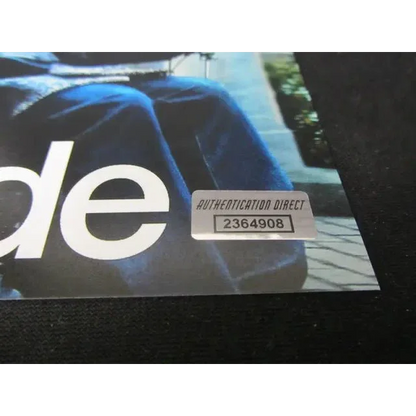 Holographic authentication sticker with serial number on Bryan Cranston signed 8x10 photo