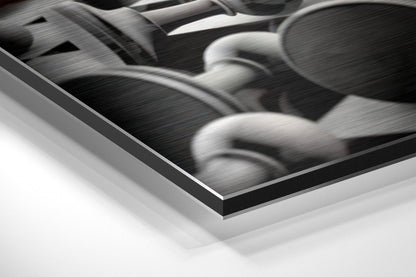 Close-up angled view of brushed aluminium Dibond wall art showing layered edge and textured black and white photograph surface.