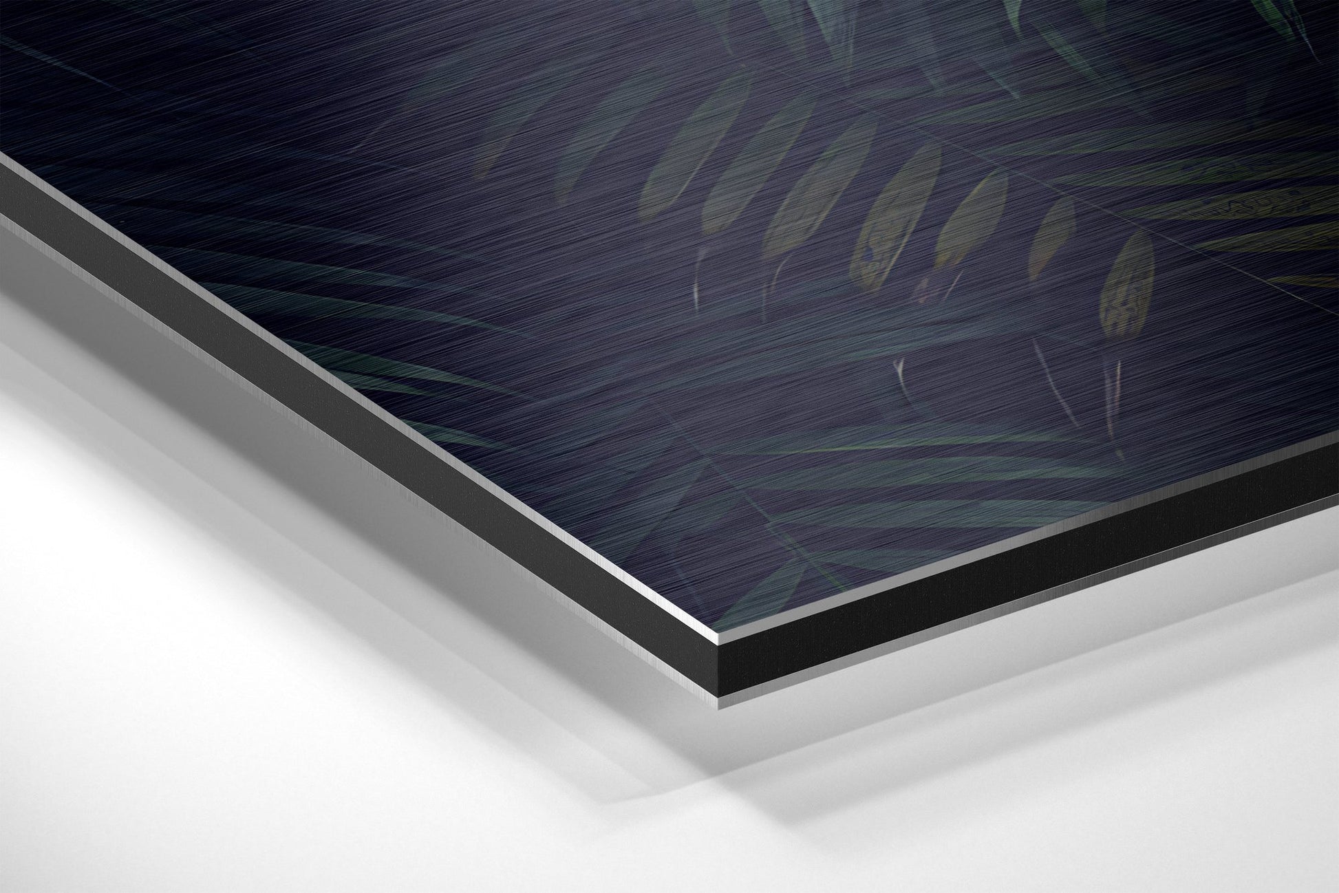 Close-up angled view showing layered edge profile of brushed aluminum dibond panel with dark printed surface and white backing layers.