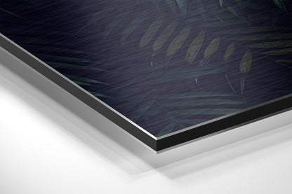 Close-up angled view showing layered edge profile of brushed aluminum dibond panel with dark printed surface and white backing layers.
