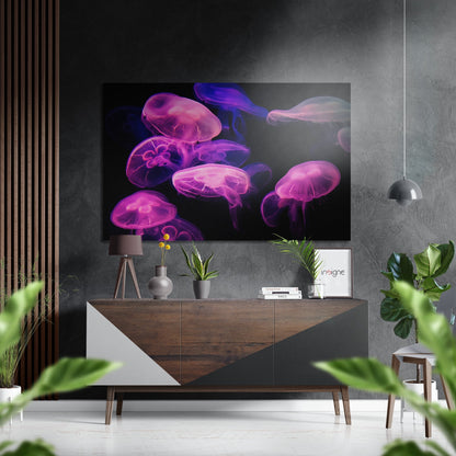 Brushed aluminium Dibond wall art displaying neon pink and purple glowing jellyfish against black background, mounted above wooden dresser in modern interior.