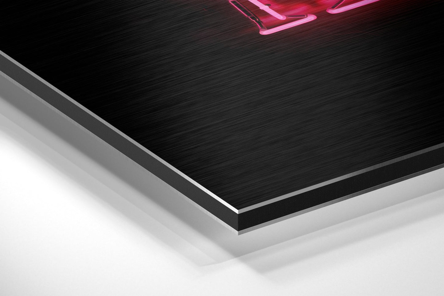Close-up angled view of layered brushed aluminium and white composite materials with pink neon sign visible at top.