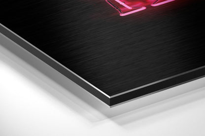Close-up angled view of layered brushed aluminium and white composite materials with pink neon sign visible at top.