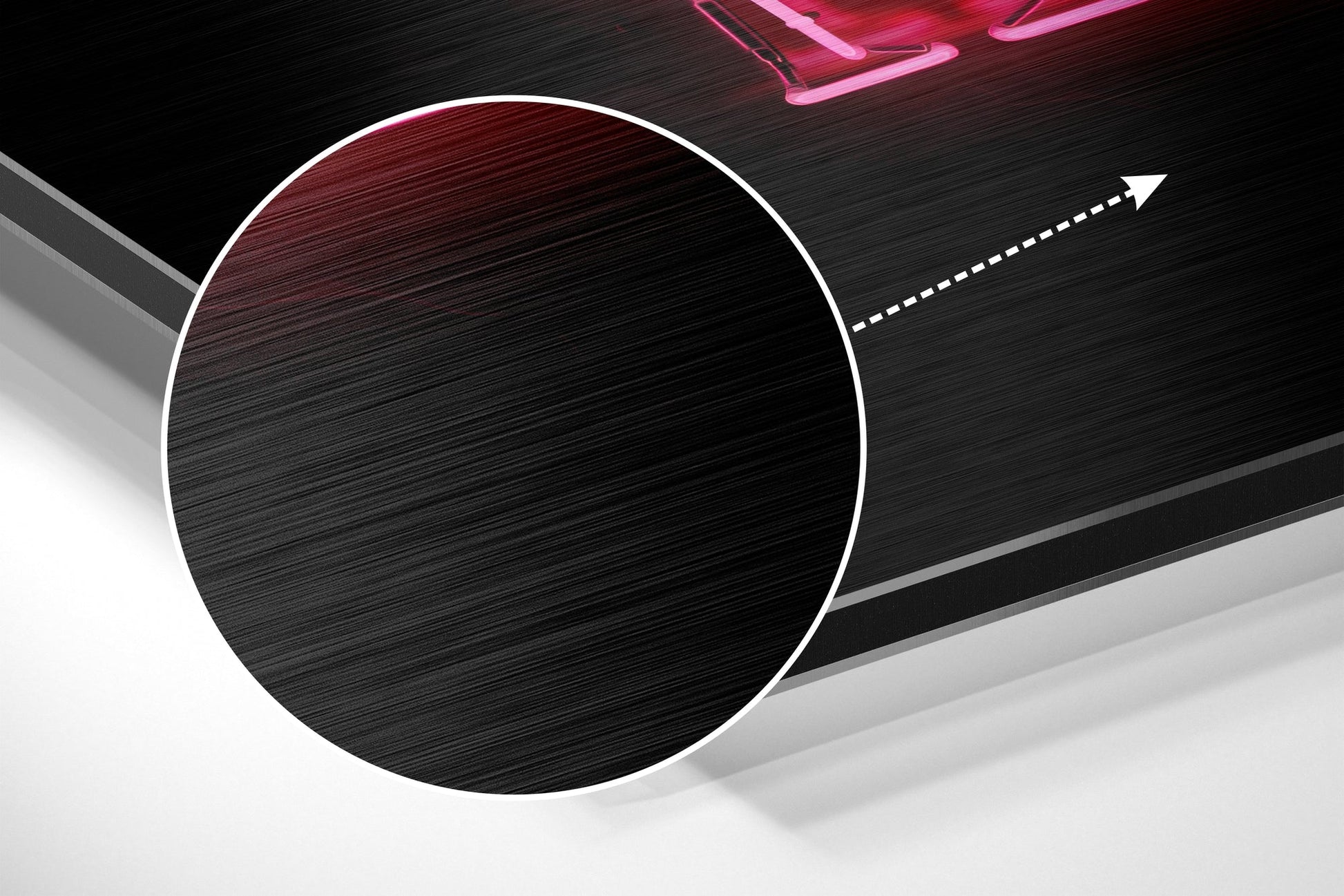 Large white-bordered black circle on brushed aluminium surface with gray planes and pink neon lighting detail, angled perspective view.