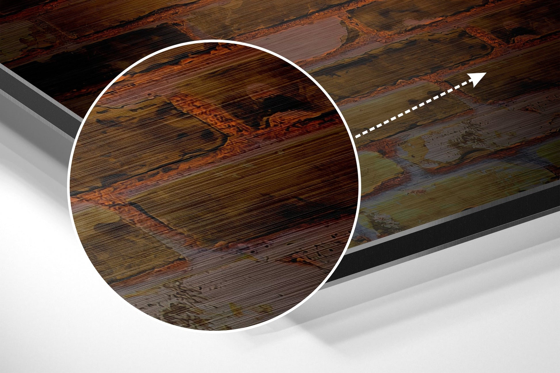 Close-up detail of brushed aluminum dibond wall art showing wood grain texture with warm brown and green tones and horizontal striations.