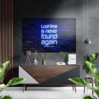 Modern living room with neon blue "Lost time is never found again" wall art mounted above wooden sideboard with potted plants and pendant lamp.
