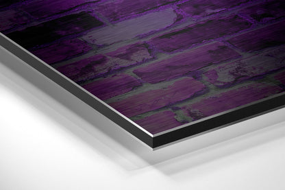 Close-up angled view of brushed aluminium Dibond wall art with purple and grey wooden plank texture, showing layered edge detail.
