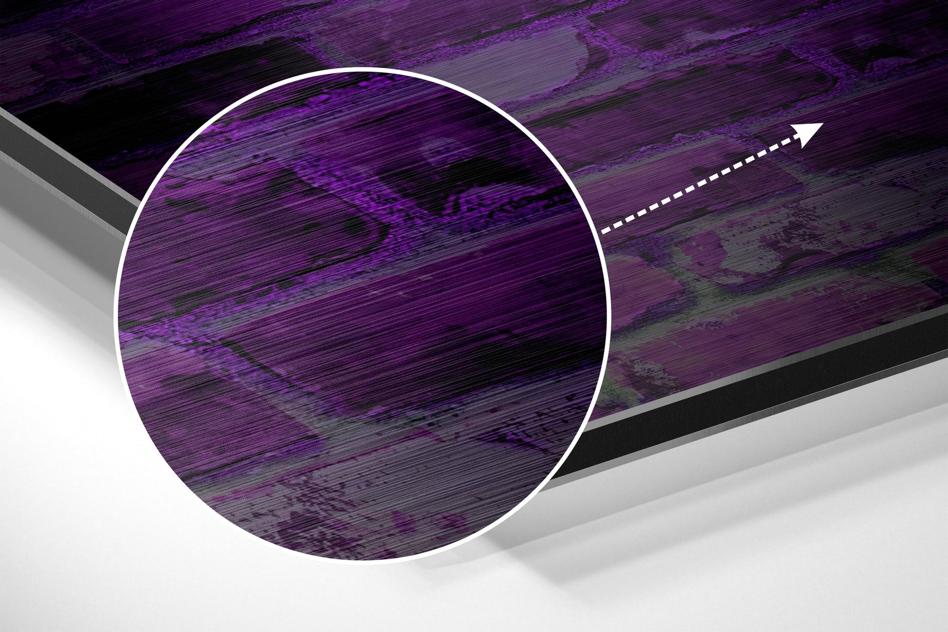 Angled close-up of brushed aluminum wall art showing purple and black striped circular design with white border and directional arrow.