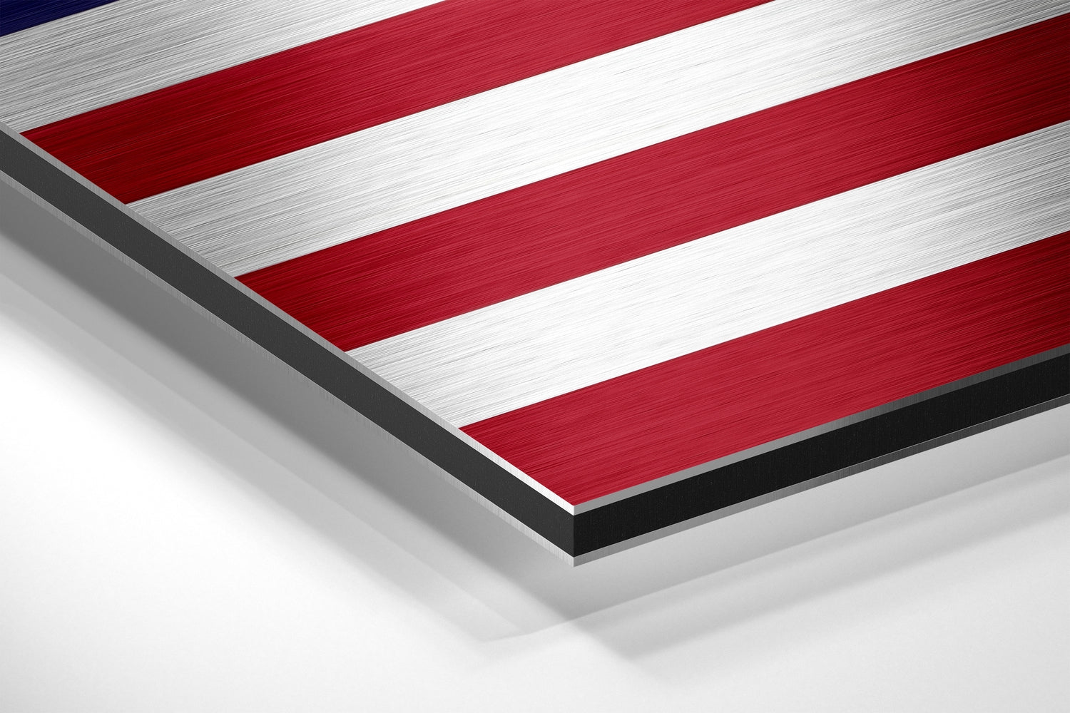Angled close-up view of brushed aluminum dibond wall art displaying red and white horizontal stripes with dark edges.