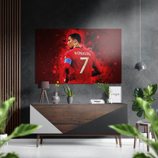 Red number 7 jersey displayed on brushed aluminium dibond mounted above wooden console in modern gray interior with plants.
