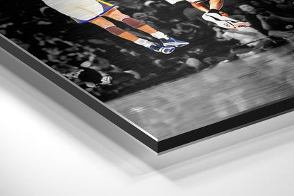 Close-up angled view of brushed aluminium Dibond wall art showing layered edge detail with black border and white backing.