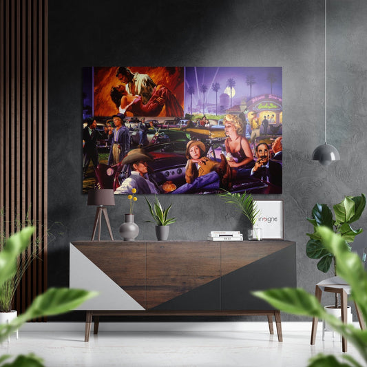 Retro drive-in cinema scene artwork displayed above wooden console table with plants and decor in modern living room setting.