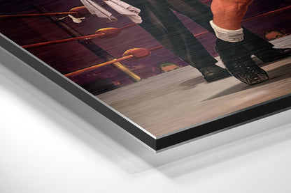 Close-up angled view of layered brushed aluminium and black edge framing on round wall art displaying warm interior lighting scene.