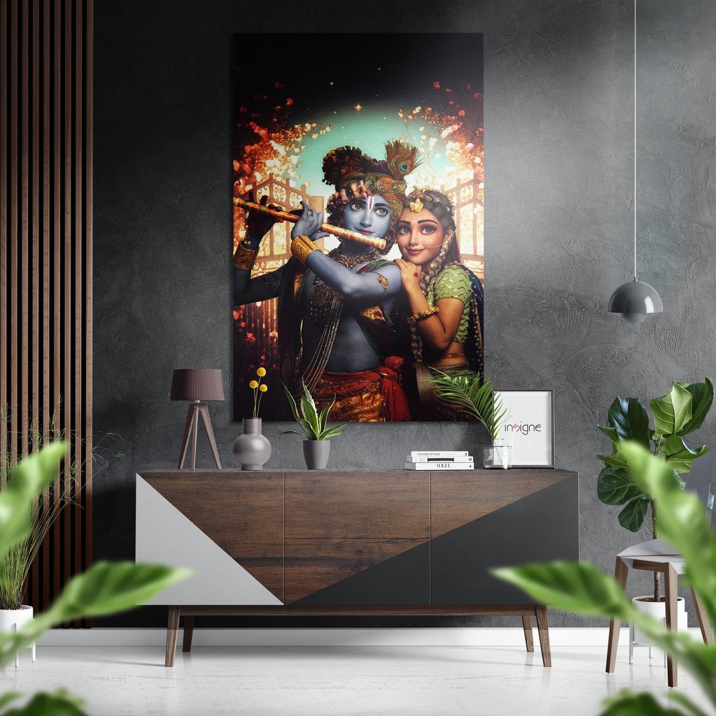 Radha Krishna Dibond wall art displayed above wooden console table in modern interior with plants and pendant lighting.