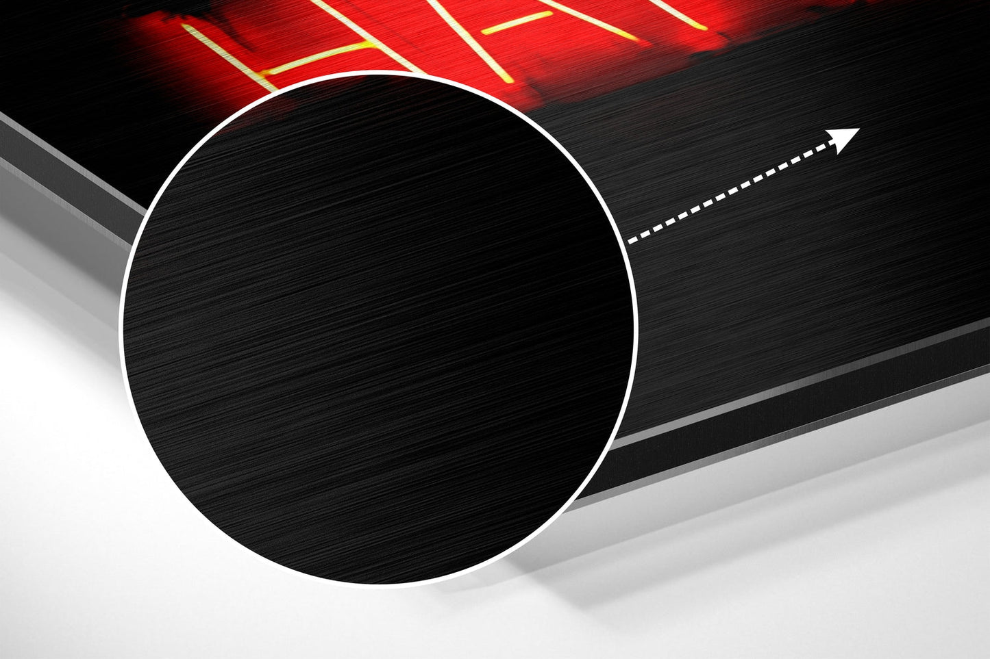Large white-outlined black circle on brushed aluminum surface with red neon sign and directional arrow above.