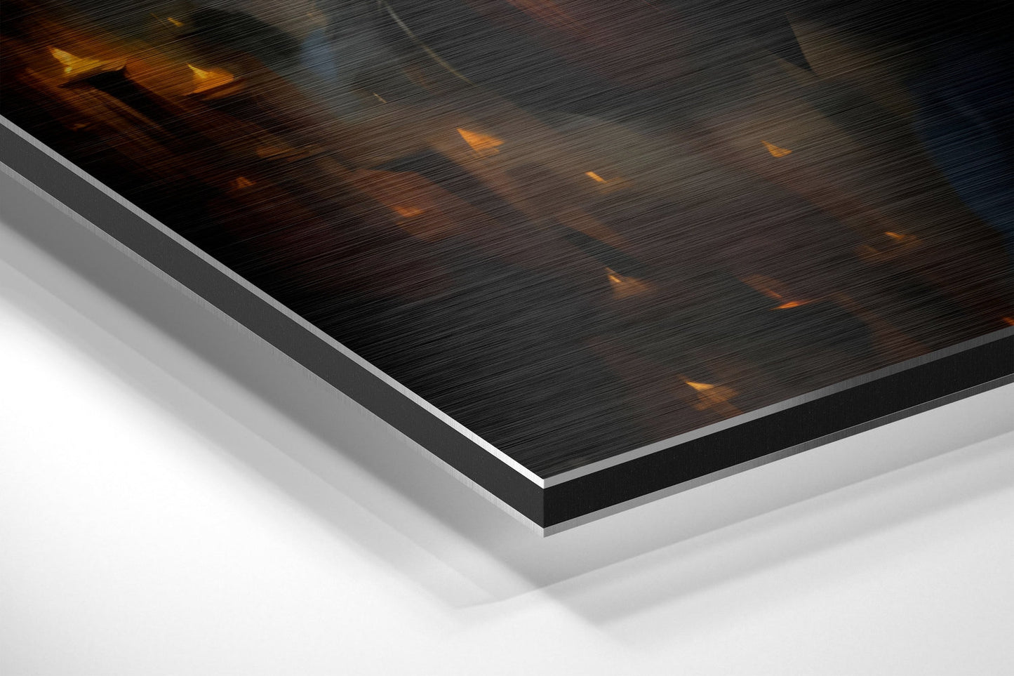 Close-up angled view of Dark Queen Brushed Aluminium Dibond showing layered edge detail with dark brushed metal surface and golden accents.