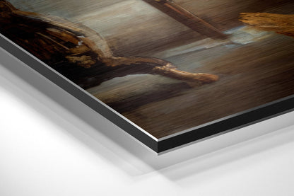 Close-up angled view of brushed aluminum Dibond print layers showing metallic silver and black edges with blurred brown wooden interior photograph.