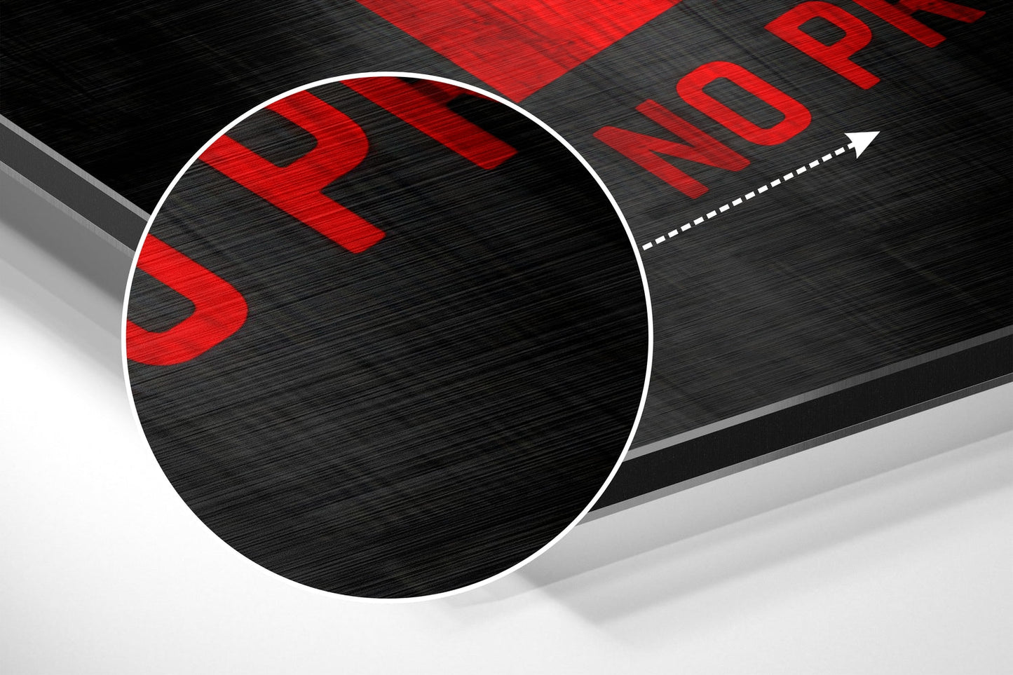 Close-up angled view of brushed aluminum wall art with red "SLOW" and "PROGRESS" text on black and gray surface with white circle detail.