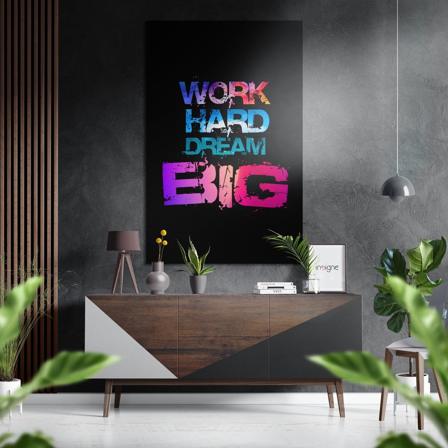 Colorful "Work Hard Dream Big" wall art in blue, cyan, and magenta displayed above a wooden console table in a modern interior setting.