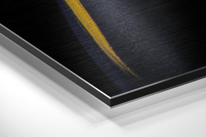 Close-up angled view of layered yellow and black brushed aluminum Dibond panel with gray edge detail against white background.
