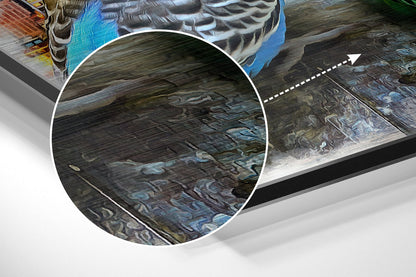Close-up detail of brushed aluminium surface showing swirling blue and grey patterns with magnified circular view highlighting texture and finish.