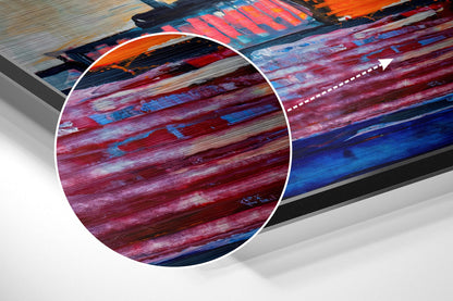 Close-up detail of brushed aluminium wall art showing horizontal streaks of deep red, blue, and white paint with textured brushstrokes.