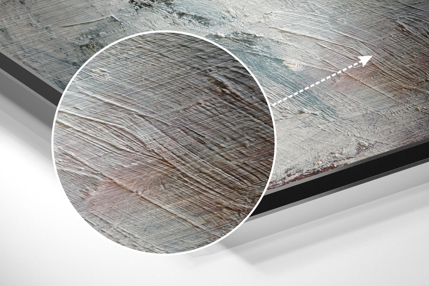 Close-up detail of brushed aluminum surface showing fine linear texture patterns in silver and gray tones with directional arrow indicator.