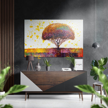 Colorful tree artwork with yellow splashes displayed above wooden console table in modern interior setting.