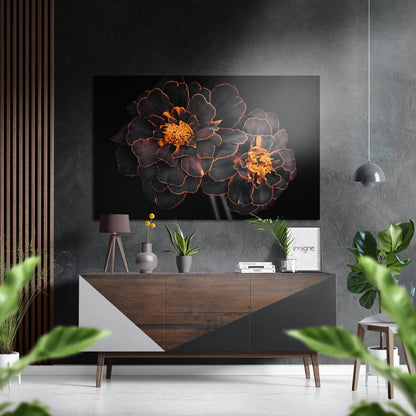Dark red and gold flowers on black background displayed above wooden console table in modern interior setting.