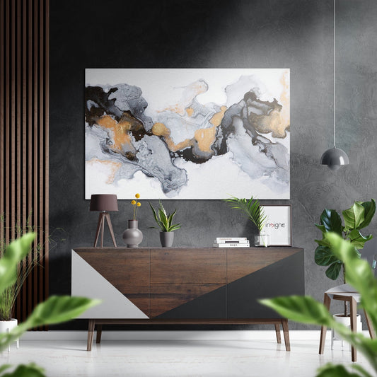 Modern living room with abstract gold and gray marble artwork displayed above wooden dresser with plants and decorative items.