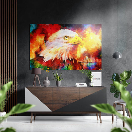 Vibrant eagle portrait with fiery red and yellow clouds displayed above a wooden dresser in modern interior setting.